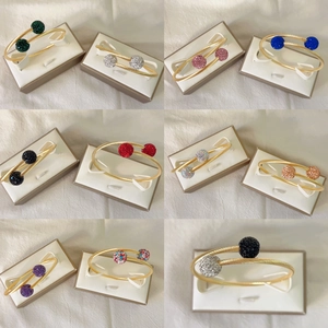 Bracelets torsadés en acier inoxydable doré 18 carats avec boules de cristal colorées