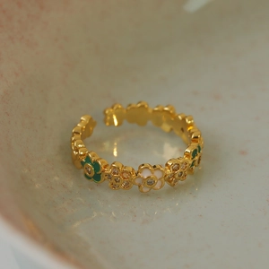 Adjustable gold flower ring with green enamel leaves and zircon crystals for women