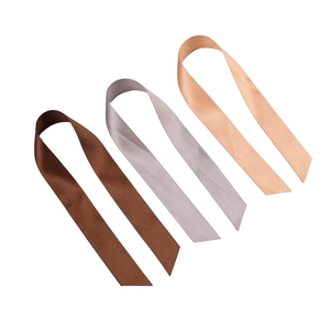 Polyester satin ribbons in brown, silver grey and champagne colors for gift wrapping