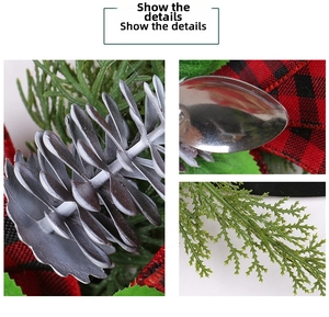 Close-up of pine cones and red-black plaid ribbon on the Christmas wreath detail