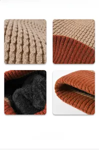 Detail of warm winter knit hat with orange patchwork pattern and soft fleece lining