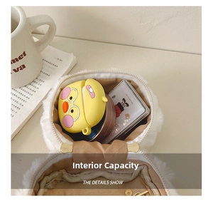 Internal capacity of mini white faux fur bag showing space for earbuds and small items