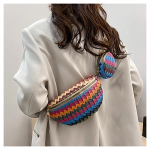 Rainbow woven crossbody bag and round coin purse set worn by a fashion model