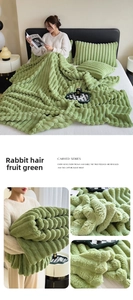 Detail of fruit green rabbit plush blanket with striped carved texture and soft pillowcases
