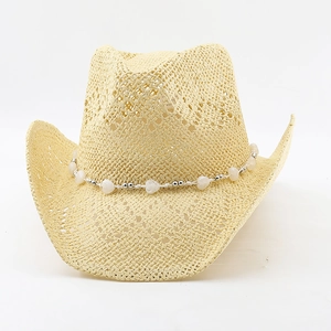 Close-up of straw cowboy hat featuring hollow weave pattern and heart bead chain