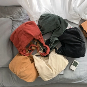 Minimalist corduroy tote bags in five solid colors including red, green, and beige