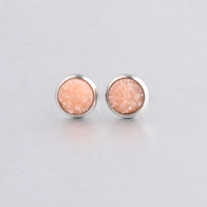 Close-up of 8mm pink starry resin earrings with silver stainless steel border