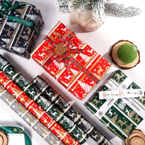 Christmas vintage wrapping paper rolls in red, green and silver with elk and snowflake patterns