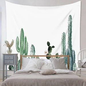 Detail of watercolor cactus tapestry showing texture on a bedroom interior wall