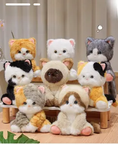 Set of eight assorted realistic plush cat toys in various breeds on a warm stepped display