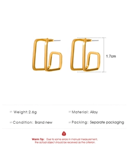 Macro detail of geometric square stud earrings showing size dimensions and weight