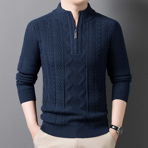 Detail of navy blue cable knit sweater with a stand collar and high-quality zipper texture