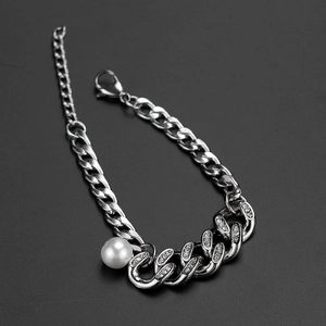Chic silver Cuban link bracelet with a white pearl and sparkling rhinestones on black