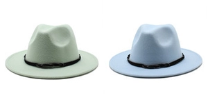 Detail view of stylish wool fedora hats in light mint green and blue with black woven bands