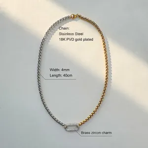 Detail of 4mm two-tone stainless steel chain with oval cubic zirconia pendant necklace
