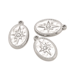 Macro detail of three silver oval star pendants with diamond inlay and beaded edge