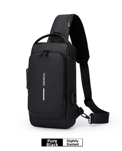 Detail view of the waterproof black sling bag showing the USB port and anti-theft lock