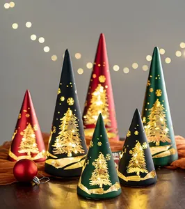 Detail of hollowed-out cone Christmas tree lamps with glowing deer and snowflake patterns