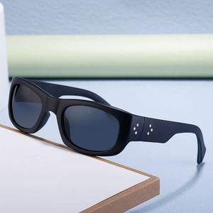 Polarized sports sunglasses for men featuring matte black frames and gold star rivets