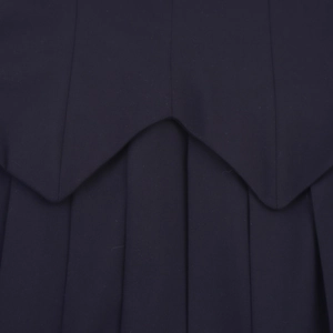 Navy blue pleated mini dress featuring wide waist pleats and contrast patchwork details