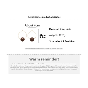 Detail view of brown resin bead hoop earrings with dimensions and weight specs