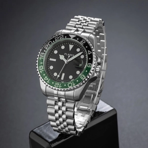 Detail of silver stainless steel watch with black dial and green-black dual color ceramic bezel