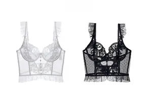 Detail of French floral lace corset top with ruffle straps and mesh dot texture