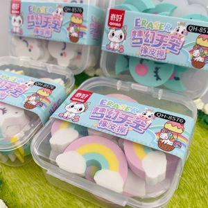 Close-up of rainbow and unicorn shaped erasers in multi-colored student stationery set