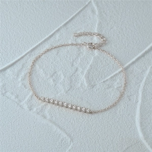Detail of s925 sterling silver bracelet with 12 small round zircons and spring clasp