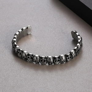Detailed view of punk gothic skull cuff bracelet in vintage silver stainless steel