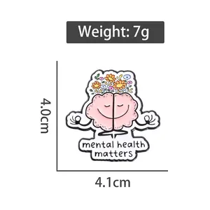 Pink brain enamel pin with colorful flowers and Mental Health Matters text on white background