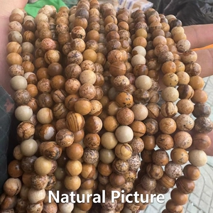 Macro shot of 8mm natural picture jasper round beads showing unique stone patterns