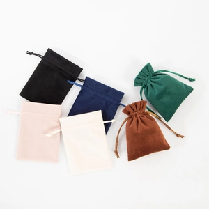 Colorful velvet drawstring jewelry pouches for storage and gift packaging on white background