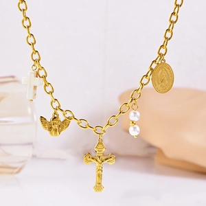 Vintage gold religious necklace with marble cross, angel pendant, and white pearls
