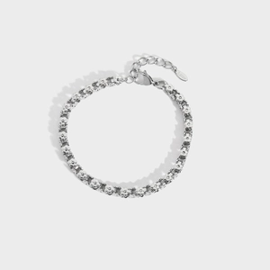 Detail of stainless steel flower link bracelet featuring lobster clasp and extension chain