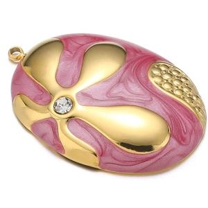 Macro shot of oval pink enamel flower pendant with gold plating and white rhinestone inlay