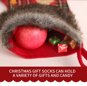 Detail of Christmas stocking showing gift capacity with apples and sweets inside