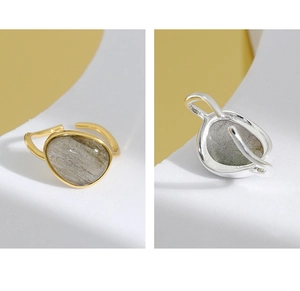 Detail of adjustable S925 silver rings featuring irregular moonstone crystal inlays