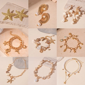 Gold starfish shell jewelry set with starfish necklace earrings and pearl bracelets