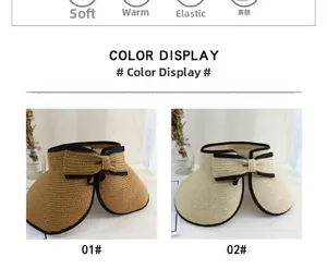 Detail of straw sun visor hats in camel and beige with black ribbon bow decoration