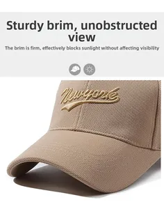 Detail of New York embroidery on khaki cotton baseball cap with structured sun visor