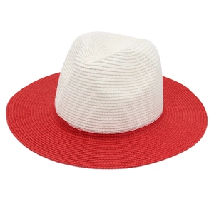 Detail of a two-tone Panama straw hat featuring a white crown and vibrant red brim