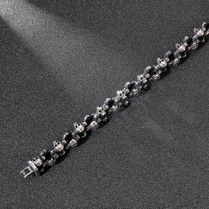 Close-up of vintage silver skull link bracelet in gothic stainless steel style