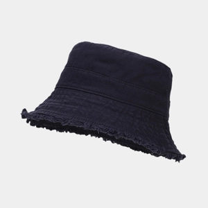 Detail of frayed edge canvas bucket hat with vintage distressed texture and stitching
