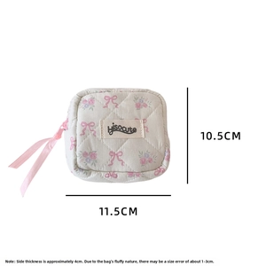 Quilted floral pouch with pink bows and brand label, measuring 11.5cm by 10.5cm size