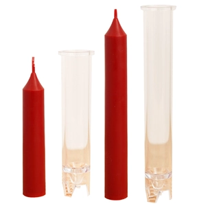 Tall red taper candles displayed with clear plastic candle making molds on white background