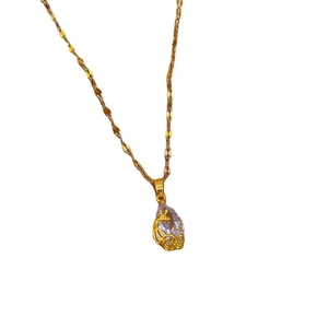 Titanium steel necklace with teardrop zircon pendant and gold phoenix design on white backdrop