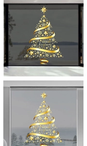 Detail of golden Christmas tree window stickers with Merry Christmas text on glass