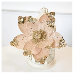 Detail of velvet champagne Christmas flower with gold glitter edges for tree decoration