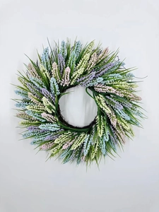 Close-up of mixed lavender wreath with realistic purple and blue flower spikes and green leaves